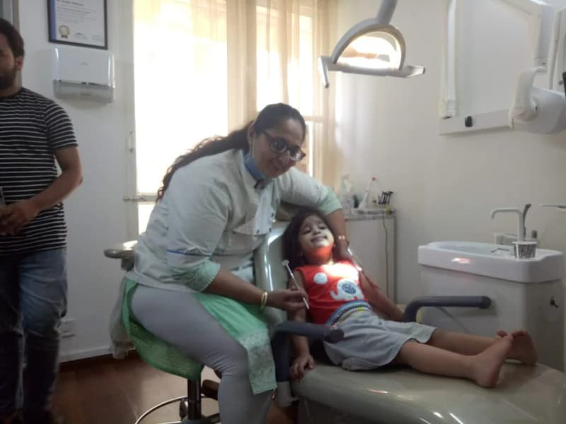 Dr. Surbhi Malhotra with a young patient